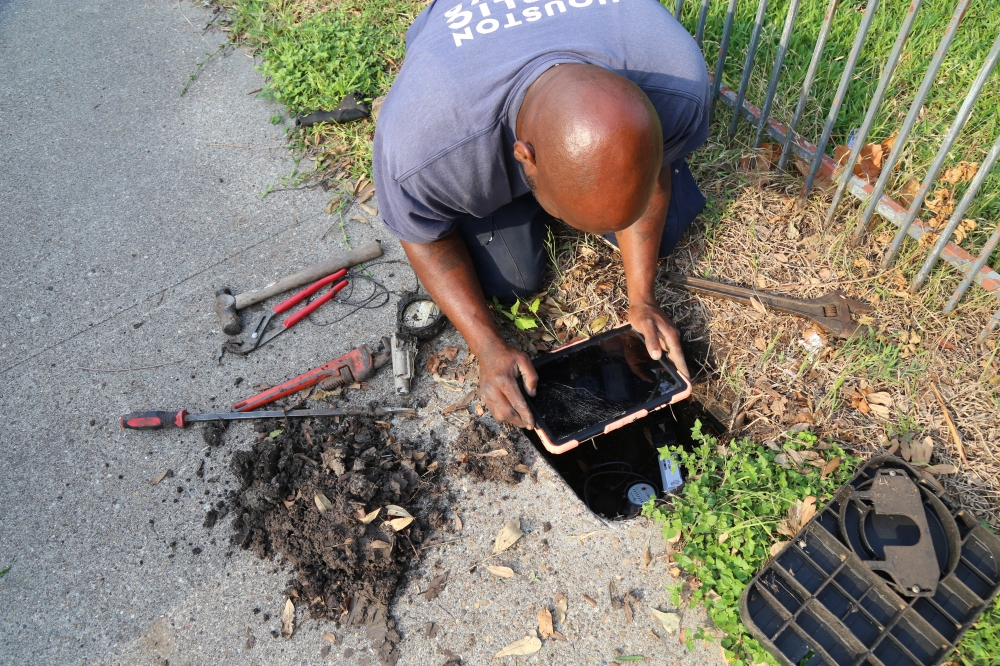 An installation of the new water usage reading equipments. Old readers were malfunctioning (Courtesy of Houston Public Works)