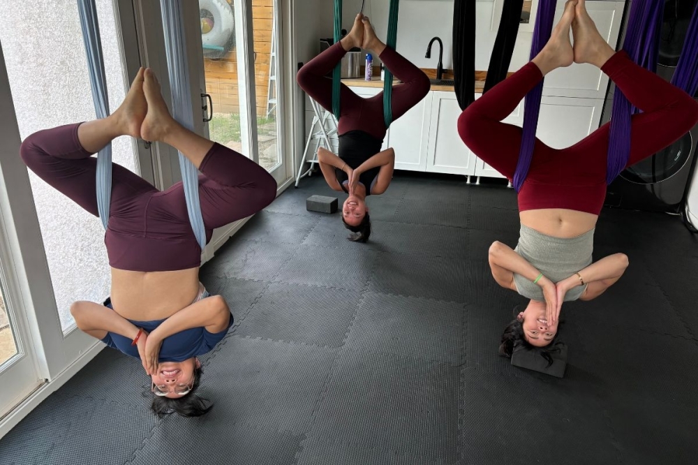 Aerial yoga can help decompress the spine and activates the core, Haagenson said. (Courtesy Aerial Yoga Houston)