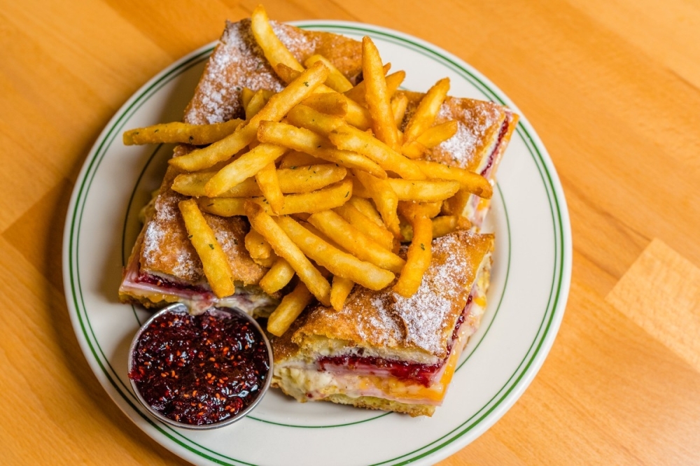 The Monte Cristo sandwich ($16) has ham, turkey, gruyere, dijon mustard and raspberry preserves. (Courtesy Louie Ayuma Photography)