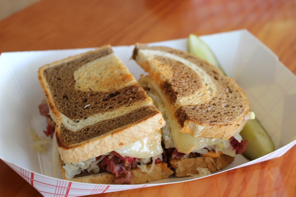 Otherside Deli's reuben sandwich ($14-$17) is pastrami, sauerkraut, Swiss cheese and Russian dressing. (Sarah Hernandez/Community Impact)