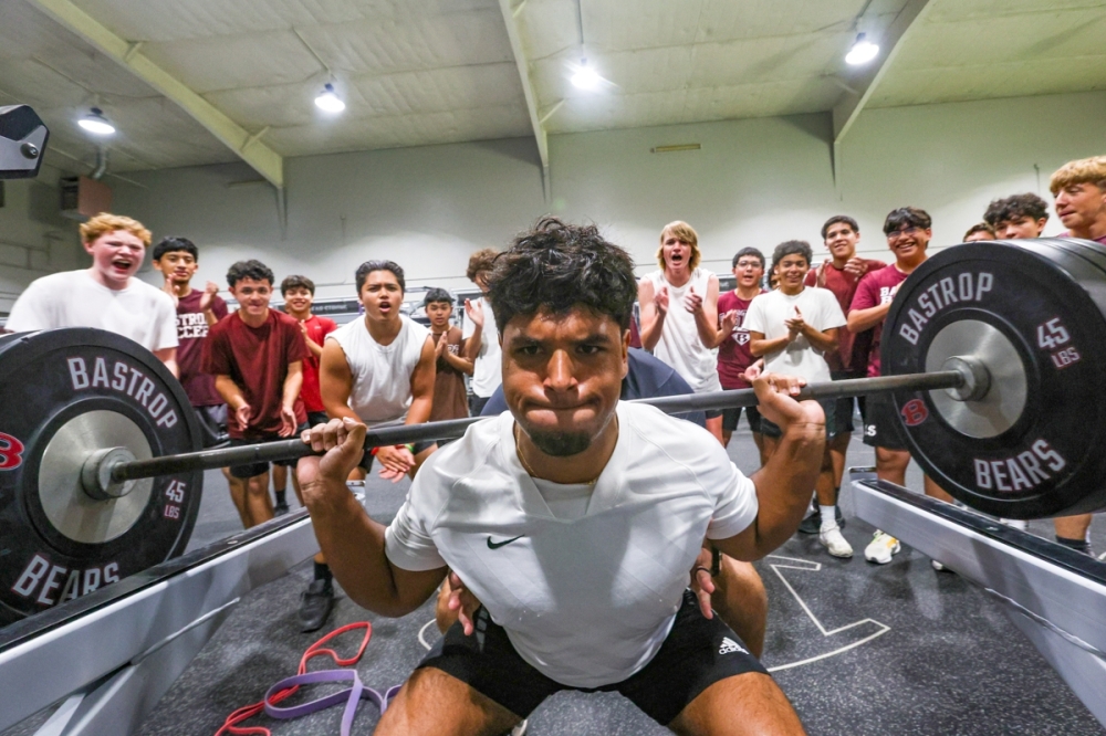 Damian Acosta, senior at Bastrop High School, works out in the new weight room. (Matthew Brooks/Community Impact)