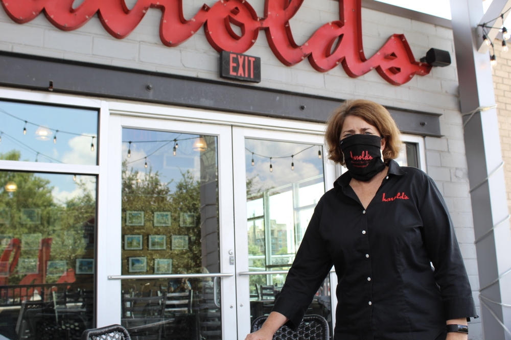 Harold's founder Alli Jarrett poses outside of the restaurant in August 2020. (Shawn Arrajj/Community Impact)