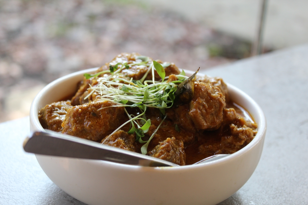 The award-winning beef rendang ($26) includes Beef banana shank, coconut curry and potato. (Jovanna Aguilar/Community Impact)