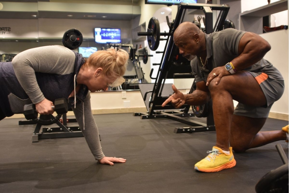 Robert Johnson (right) offers personal training programs to clients at a private Sugar Land studio. (Courtesy Robert Johnson Training)