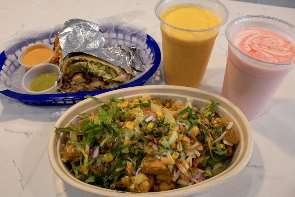 In addition to the Indian-Mexican fusion dishes such as the curry chicken bowl and lamb barbacoa taco, Sivestar Indian Tacos also offers Indian drinks such as mango and rose lassi. (Elisabeth Jimenez/Community Impact)