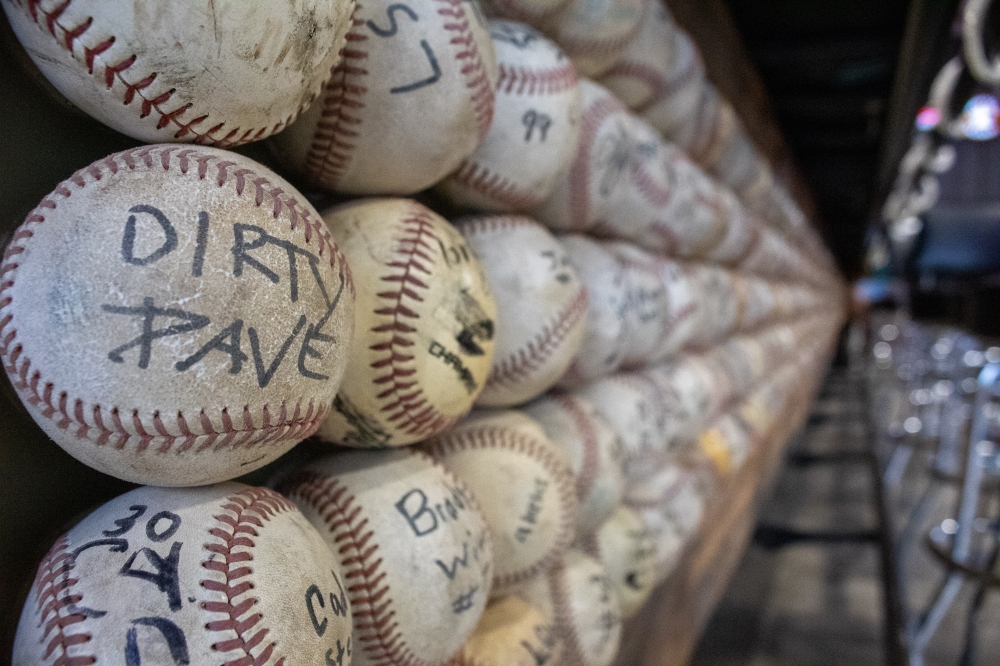 The Driftwood Axe House is located at the former Driftwood Dugout Sports bar, which had a counter decorated with baseballs from former baseball players who practiced at the Driftwood Dugout field. (Elisabeth Jimenez/Community Impact)