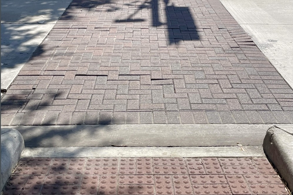 The shifting concrete pavers at Buffalo Speedway and Sunset Boulevard have created a safety issue for pedestrians crossing the intersections in West U. (Courtesy West University Place)