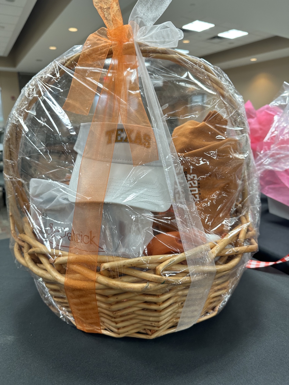 Popular auction items include alumni baskets from various universities. (Courtesy Bastrop County Emergency Food Pantry)