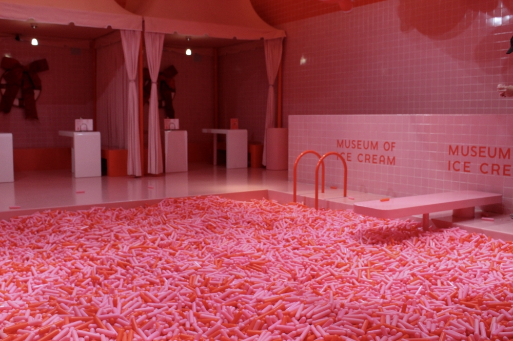 The Museum of Ice Cream decorated its well-known sprinkle pool, which guests are welcome to play in, with holiday ribbons and other decorations for its Pinkmas holiday event. (Sarah Hernandez/Community Impact)