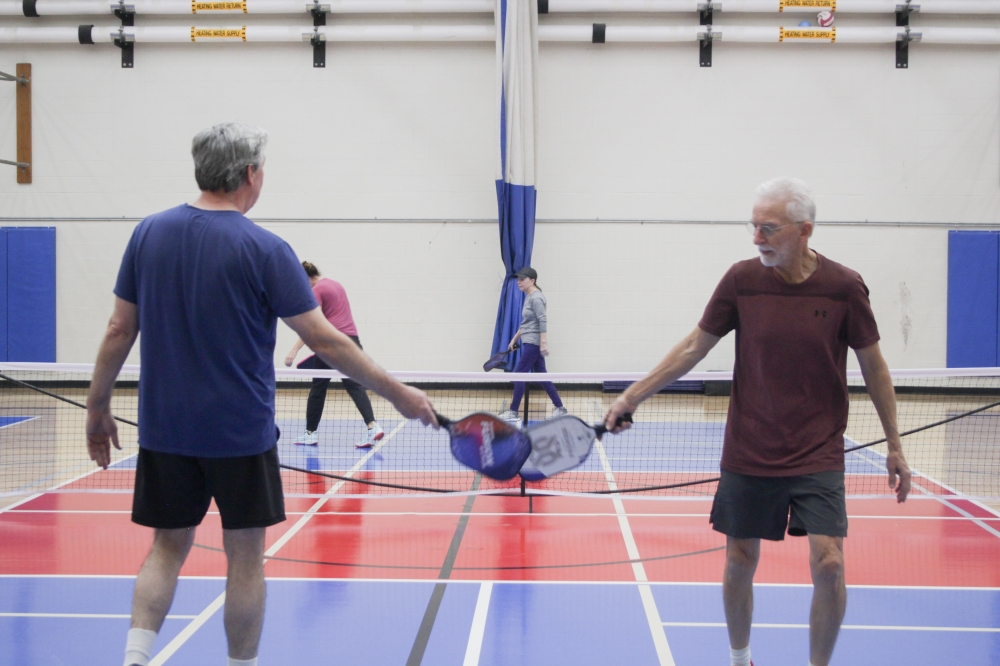 The social aspect of pickleball can be a good outlet for seniors who may face feelings of loneliness, DMA Companies Marketing and Communications Director Blake Mauldin said. (Elisabeth Jimenez/Community Impact)