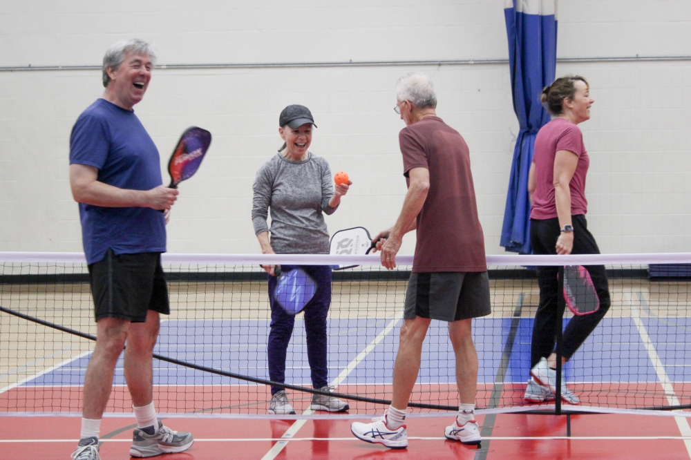 Pickleball sessions at the YMCA often have mixed age ranges and give players the opportunity to engage with many people. (Elisabeth Jimenez/Community Impact)