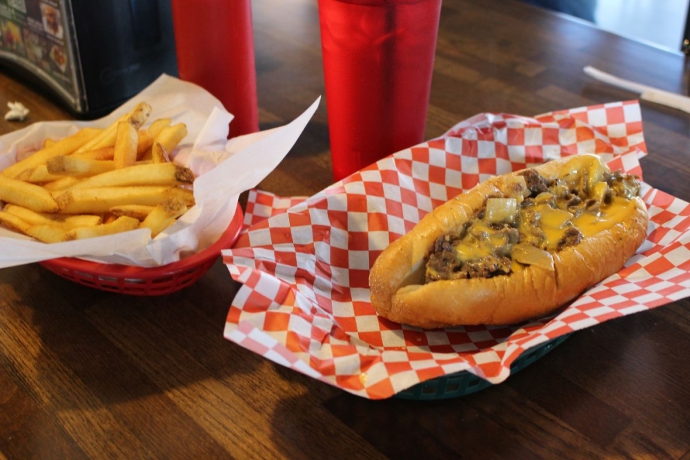 What constitutes an authentic cheesesteak depends on the region in Pennsylvania, said Philly Flats owner Scott Boyer. Some may say a cheesesteak has wiz cheese—a melty, Kraft cheese—instead of provolone or American. (Asia Armour/Community Impact)