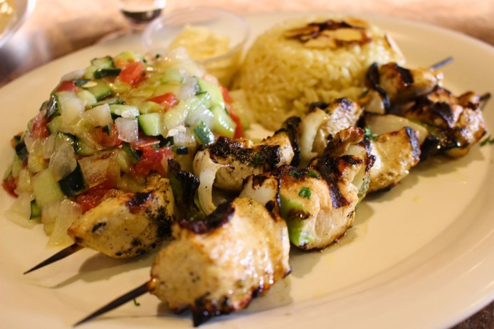 Chicken kebab plates ($17.89) includes two skewers of grilled, marinated meat, rice and a Mediterranean salad. (Asia Armour/Community Impact)