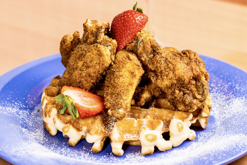 The chicken and waffles dish at Comfort Foodies features fried wings on top of a Belgian-style waffle. (Courtesy Comfort Foodies)