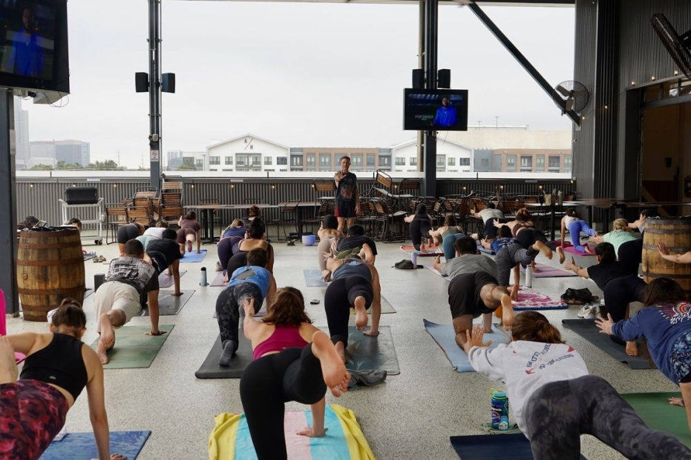 Tejas Brewery hosts a yoga session on its rooftop this winter. (Courtesy Tejas Brewery via Facebook)