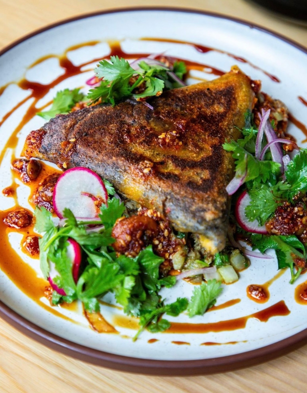 Pictured are the Duck Carnitas Tetela which are tacos with sweet potato, onion, cilantro-herb dressing, salsa macha ($22). (Courtesy Bulevar Mexican Kitchen)