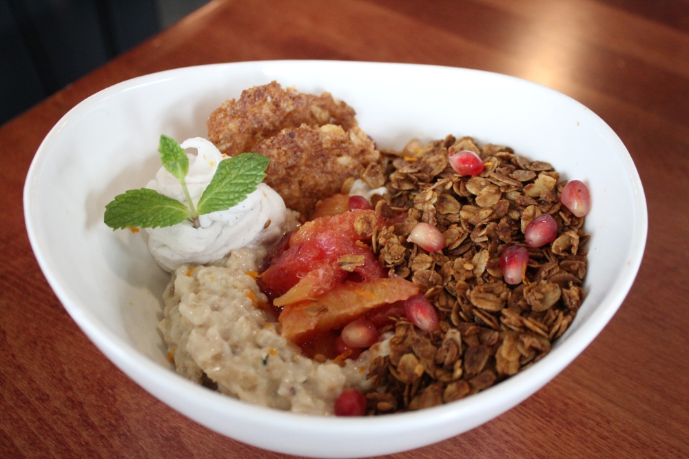 The overnight oats ($12) include oats, chai-poached pears, ginger granola, dried cranberries, brandy snap tuile, coconut whip and orange zest. (Sarah Hernandez/Community Impact)