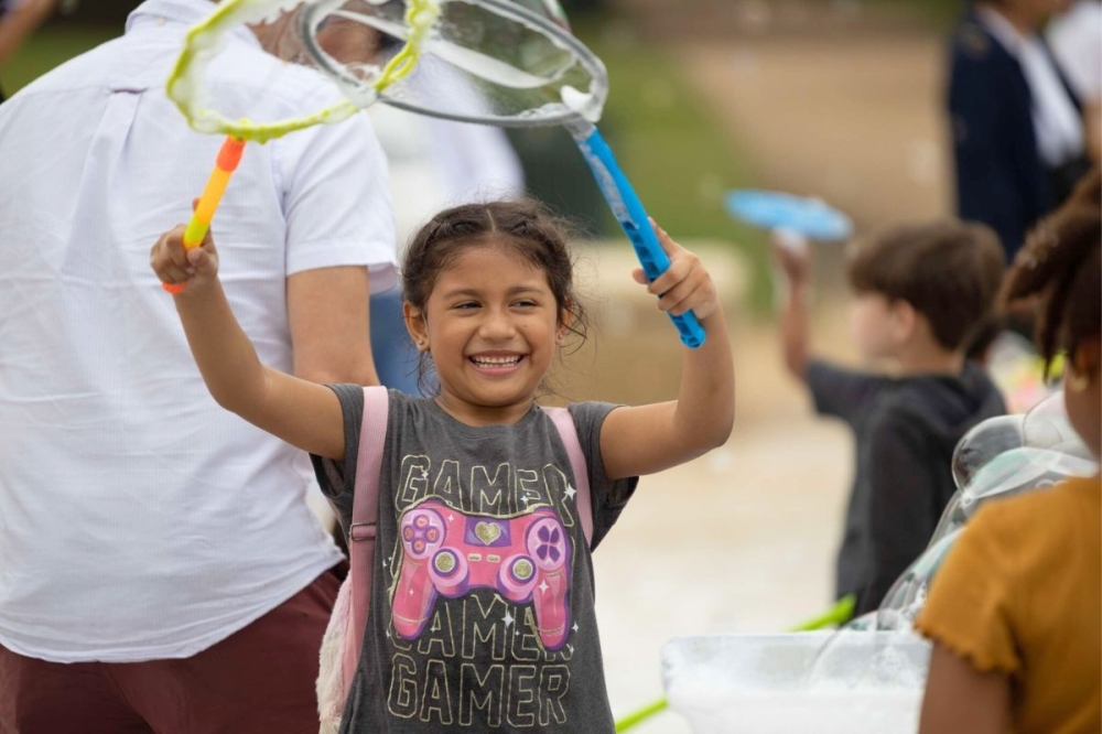 The Kite Festival at Hermann Park features a live DJ, interactive games and kid’s activities, face painting, stilt walkers. (Courtesy Hermann Park Conservancy)