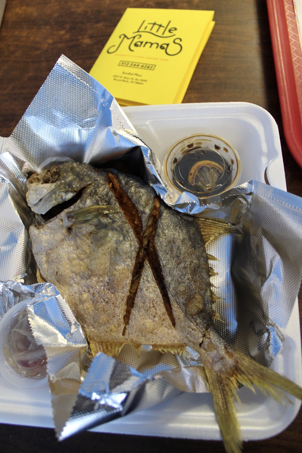 The restaurant has 'awesome specials' that are displayed on a chalkboard when entering the business. The Whole Fried Pompano fish is a special available for $16.99. (Dacia Garcia/Community Impact)