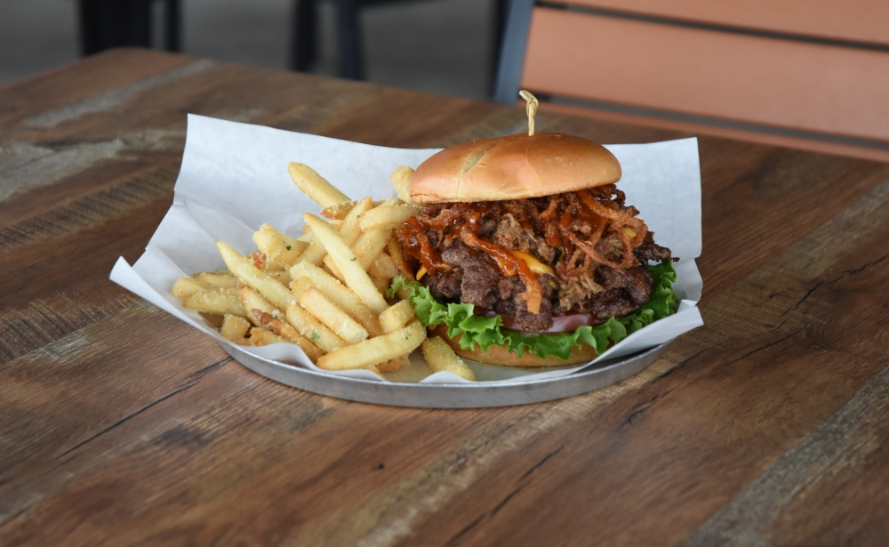 The Fat Boy Special is an overwhelming compilation of 1/2 pound smash burgers and house-pulled pork. When paired with the brewery's best-selling Float the River Kolsch, it provides a sound foundation for an evening of rest and relaxation. (Sam Schaffer/Community Impact)