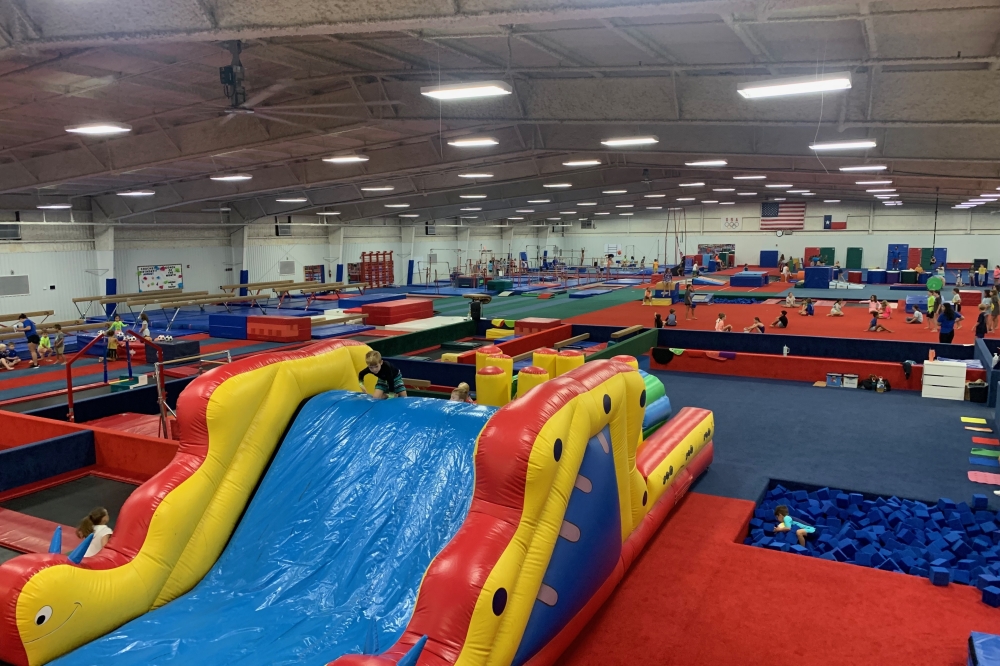 The camp offers age-specific activities, such as sports, gymnastics, crafts, a carnival day, open gym, obstacle courses, bounce houses and water slides. (Courtesy Camp Westwood)