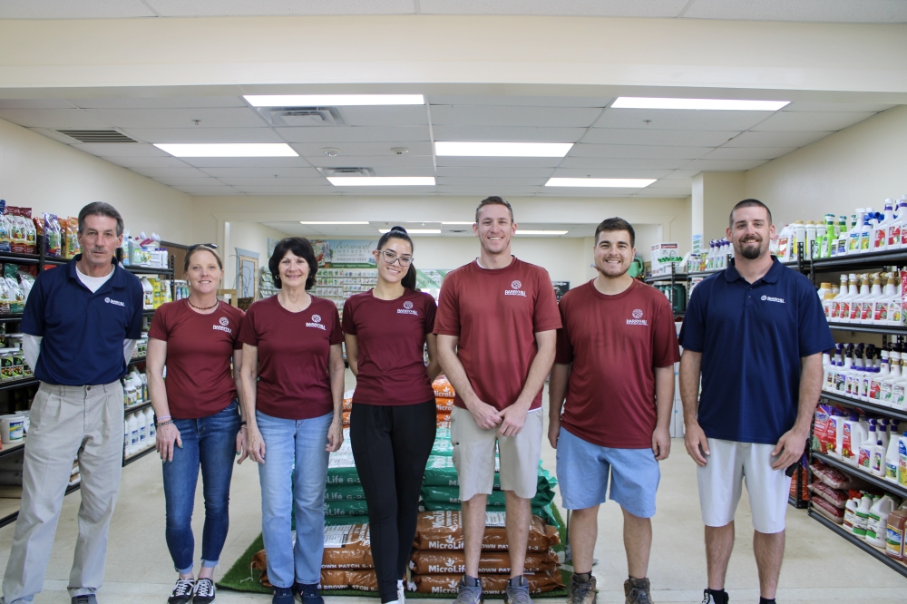 President Kevin Barry (far left) took ownership of the business in 2021 after managing it under its previous name, Red Barn Garden Center. (Dacia Garcia/Community Impact)