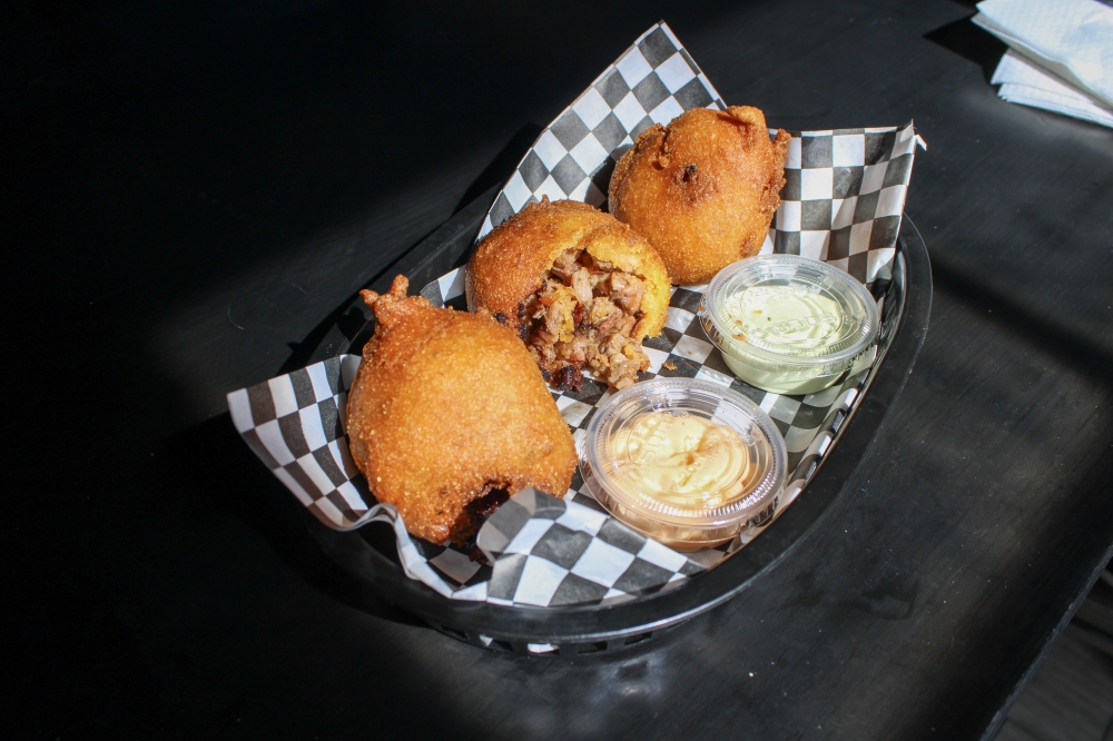 Brisket hushpuppies are available on Wednesdays at three for $11. (Dacia Garcia/Community Impact)