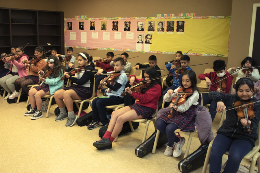 Students begin string instrument instruction in first grade at Bob Hope School. (Courtesy Bob Hope School)