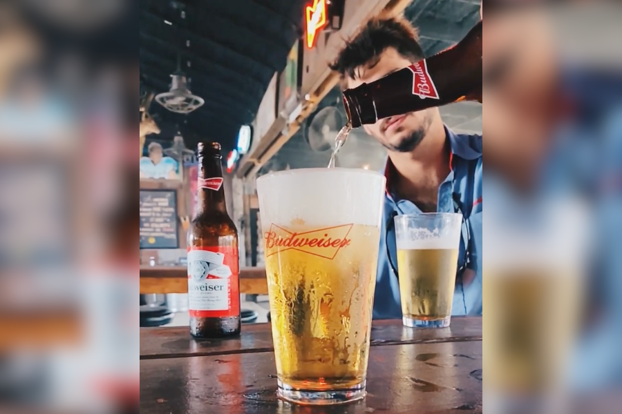 Bartender pours beer from beverage distributor in New Braunfels