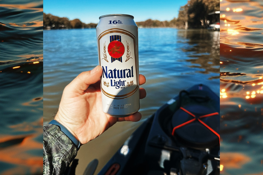 Person holds beer on lake from beverage distributor in New Braunfels