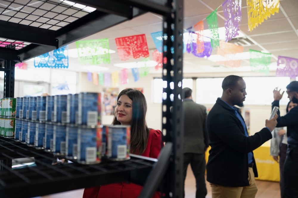 Precinct 4 Commissioner Lesley Briones checks out canned goods at La Tiendita. (Courtesy Harris County Precinct 4)