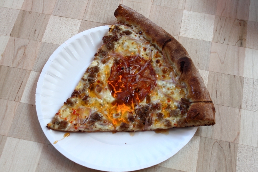 The Sweet Sausage pizza ($6/$33) has ricotta cheese, mozzarella, crumbled sausage, soppressata, red onion, and Calabrian honey. (Sarah Hernandez/Community Impact)