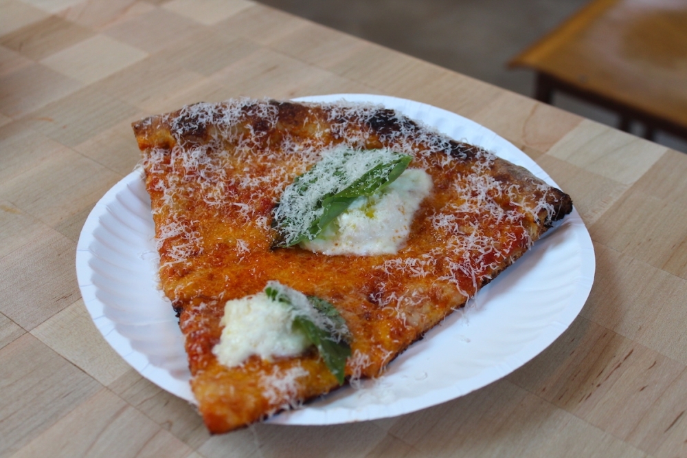 The Stracciatella pizza ($6/$33) has tomato sauce, mozzarella, fresh basil, grana padano, and olive oil with homemade stracciatella. (Sarah Hernandez/Community Impact)