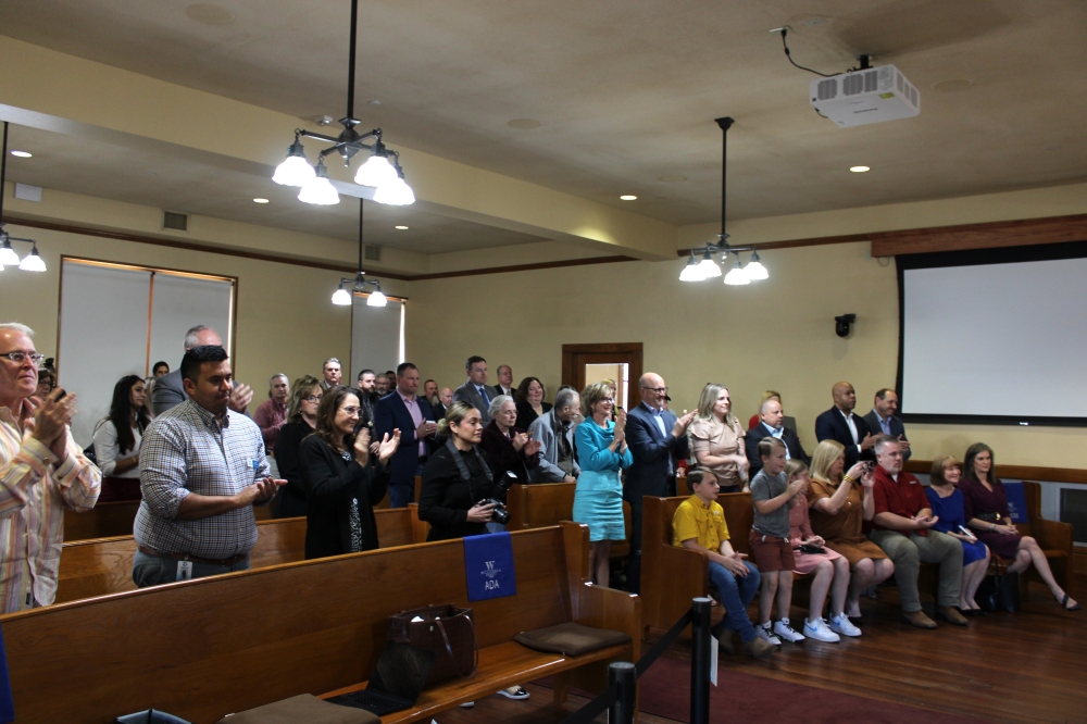 Following Williamson County Judge Bill Gravell's announcement of his resignation at a March 11 commissioners court meeting, he received a standing ovation inside the courtroom. (Anna Maness/Community Impact)