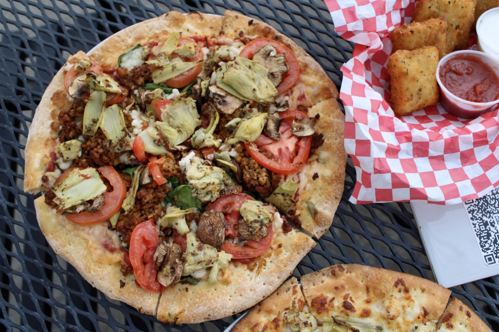 The restaurant offers vegan options like The Spock, a vegan pizza with marinara sauce, vegan sausage, vegan cheese, spinach, Roma tomato, mushrooms and spicy marinated artichoke hearts, $17-$22. (Dacia Garcia/Community Impact)