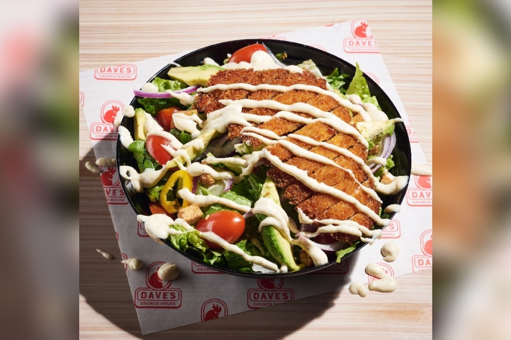 Dave's Crunch Salad features fried or grilled chicken with romaine lettuce, avocado, red onion, grape tomato, garlic croutons and caesar dressing. (Courtesy Dave's Crunch House)