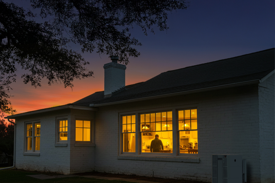 Home with lights on view from outside