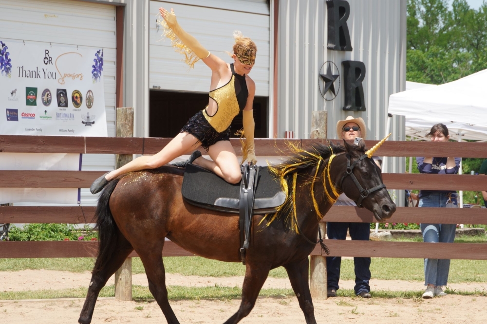 Barbara Tippett performs using a method called liberty training, a technique where the horse performs tasks and routines without the use of a bridle or saddle, relying solely on the trust and connection between the horse and trainer. (Courtesy Restoration Ranch)