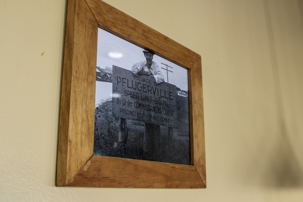 Customers at the restaurant have donated photos of the town's history to be showcased on the walls throughout the years. (Dacia Garcia/Community Impact)