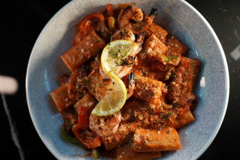 Their spicy rigatoni is served in a Cajun-infused tomato gravy with sauteed peppers. (Courtesy Confessions Restaurant & Lounge)