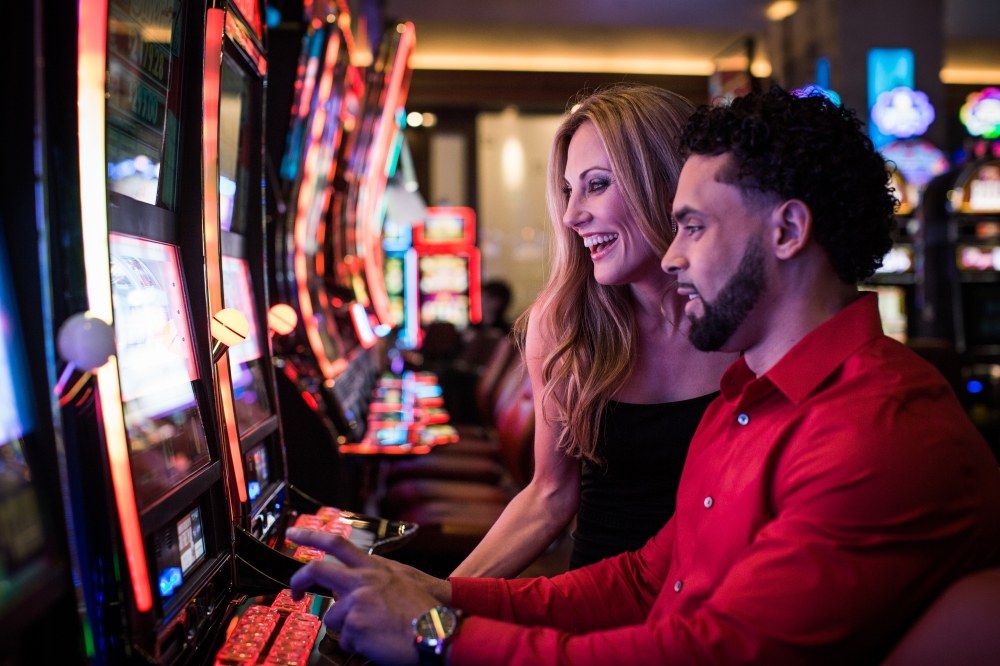 People playing slot machines in Casino near Texas