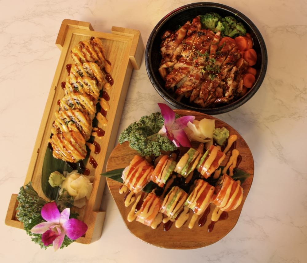 Customers can find a range of rolls, bowls, bento boxes, ramen and more. Pictured are the Austin Roll for $12.99, the Hallelujah Roll for $13.99 and the Chicken Teriyaki Bowl for $9.99. (Dacia Garcia/Community Impact)
