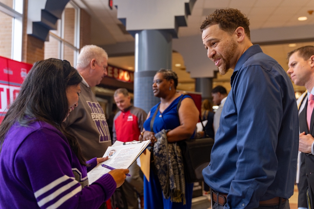 Individual talks to recruiter from FBISD about the year-round job opportunities at Fort Bend ISD