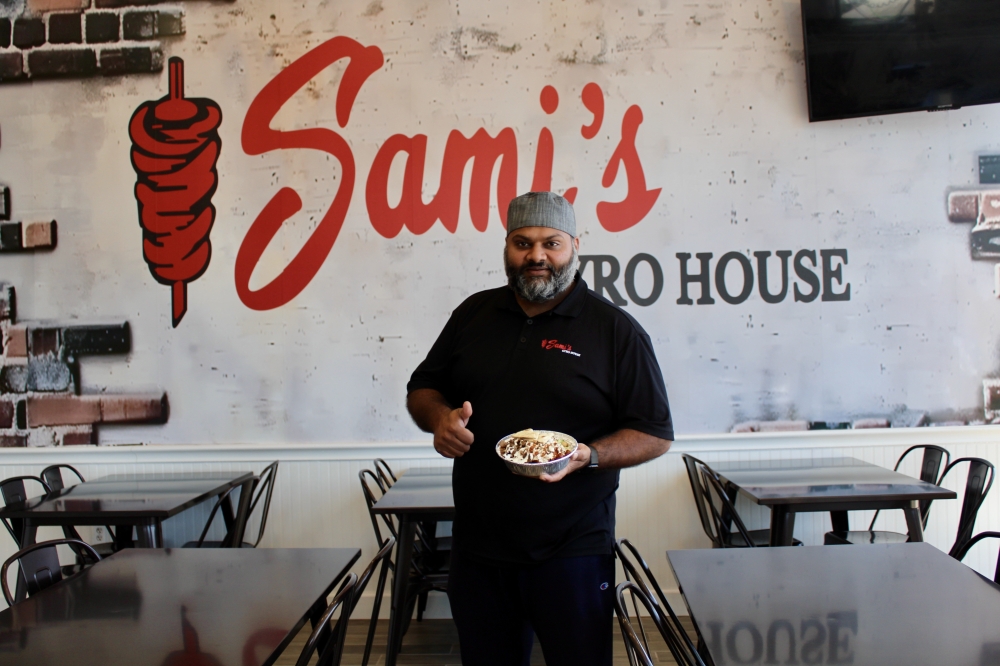 Sami's Gyro House owner Yousaf Mohtsham serves gyro platters in Spring and south Houston. (Jovanna Aguilar/Community Impact)