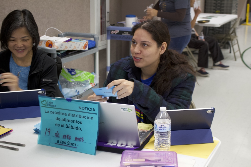 Staff member Vilma Toledo's daughter (right) also works at Fort Bend Care Center and helps translator for Spanish-speaking clients. (Kelly Schafler/Community Impact)