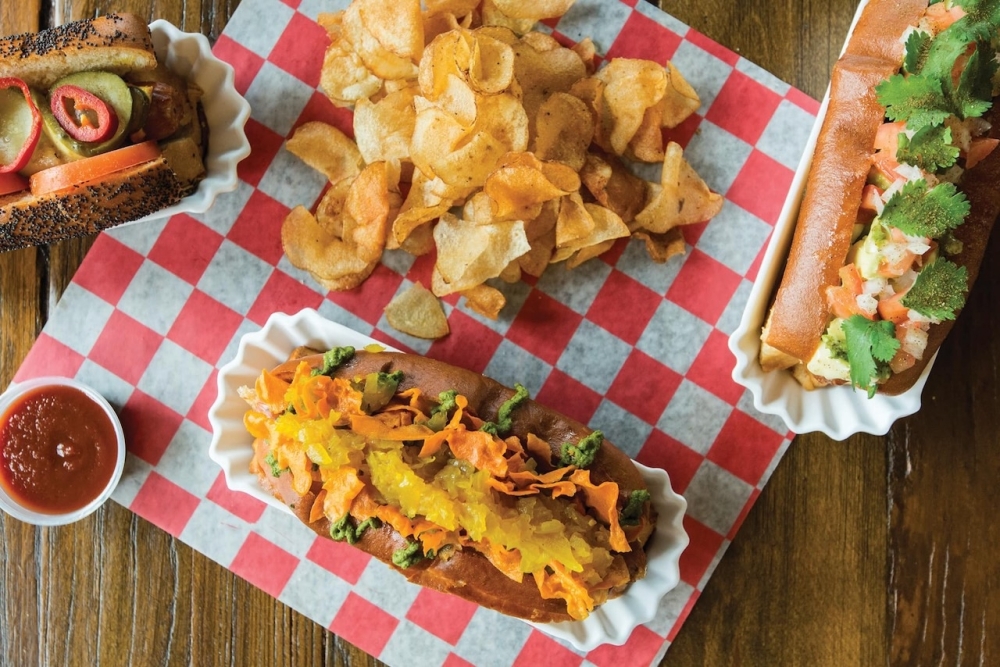 Good Dog Houston has served handcrafted hot dogs, salads, sides and shakes, offering guests the ability to dine on the dog-friendly patio with their selection of rotating local craft beers, according to the eatery’s website. (Courtesy Good Dog Houston - Heights)