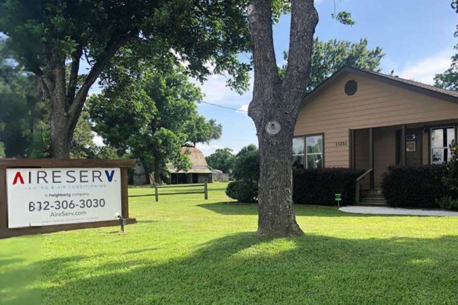 Exterior of Aire Serv of Houston Northwest office location in a residential-style building surrounded by trees, representing trusted local HVAC services in Cypress, Houston and surrounding areas.
