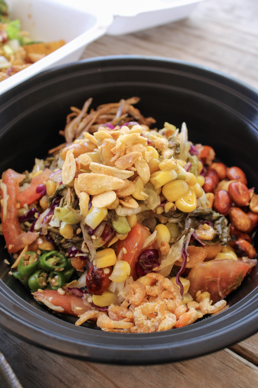 The Green Tea Salad features green tea, cabbage, tomato, green chili and assorted fried beans with dry shrimp or fried fish for $6.99. (Dacia Garcia/Community Impact)