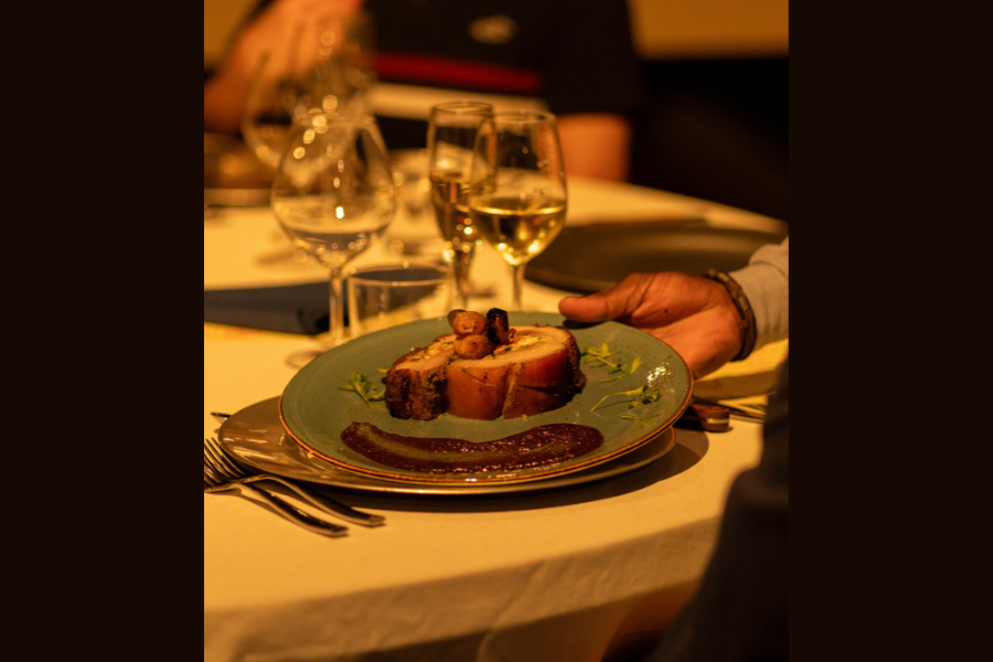 Server presents steak at Fine dining restaurant in Lakeway