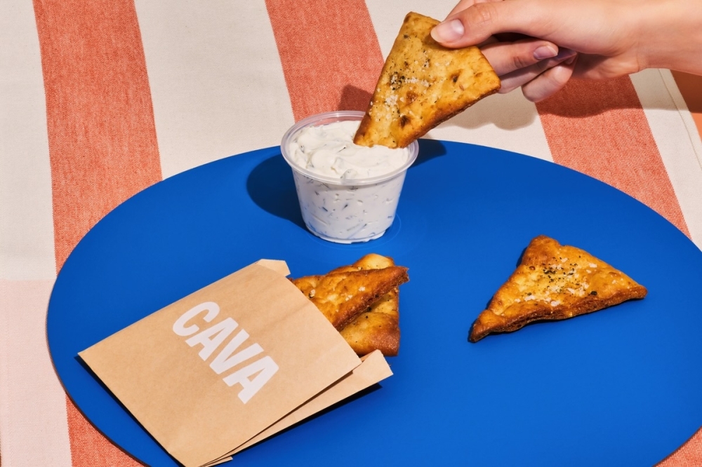 In addition to customizable bowls and pita wraps, Cava offers pita chips and other sides. (Courtesy Cava)